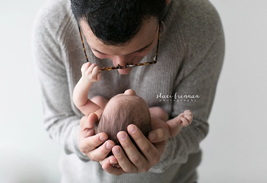 dad holding newborn photography nyc